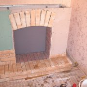 Facing the fireplace with drywall: features and installation