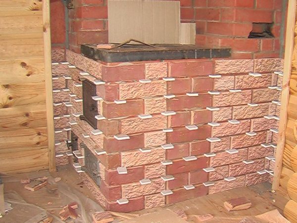 Tiling of stoves with ceramic tiles