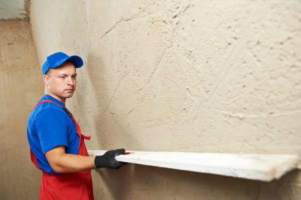 What layer of plaster can be applied to the wall
