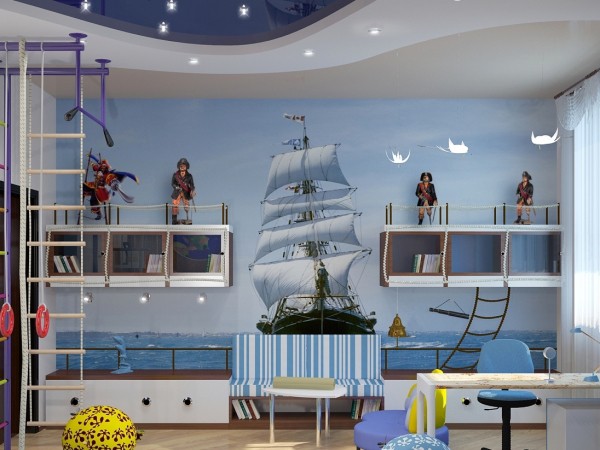 Sur la photo, la chambre des enfants d'un jeune pirate, avec des peintures murales pour les garçons avec l'image d'une frégate rapide contre la mer bleue et le ciel