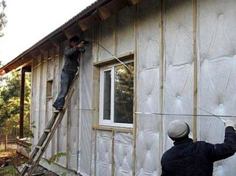 Fixing waterproofing to insulation