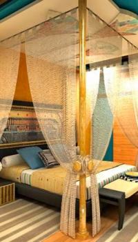 Egipto stiliaus miegamajame.