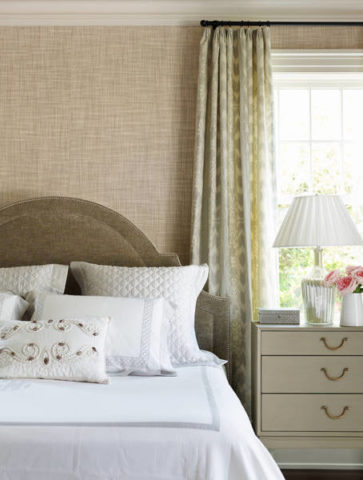 Textured wallpaper makes the bedroom interior cozy and warm.